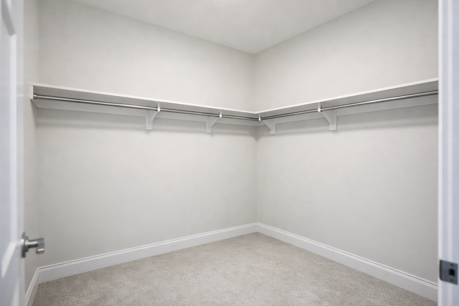Image of an example of an average builder-grade closet in a newly built Houston home, featuring a single shelf and hanging rod.