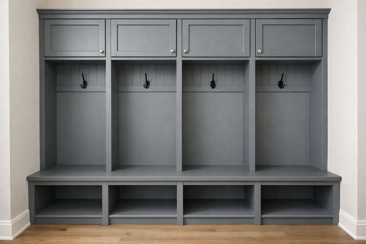 Custom entryway mudroom with built-in bench, storage cubby, and hooks in a contemporary gray finish.
