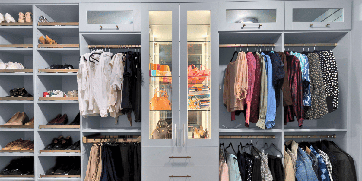Image of a custom walk in closet with a built-in vanity. 