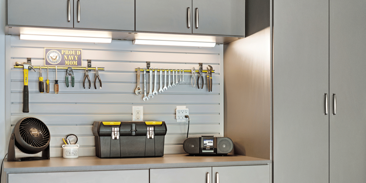 Custom Houston garage with slatwall storage panels, bike hooks, and organized tools mounted on the wall