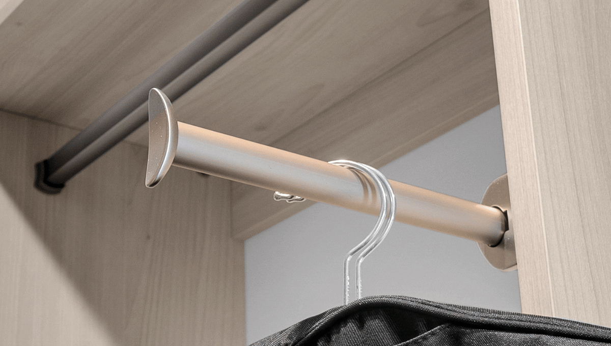 Close up image of a valet rod in a custom closet designed in Houston, Tx.