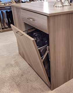 Brown cabinet that pulls open.