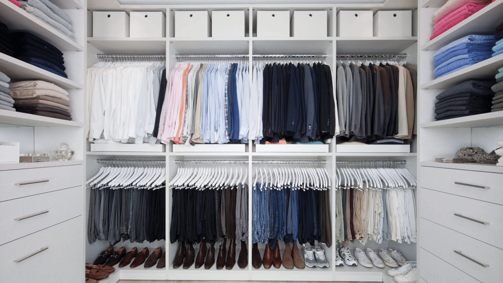 Neatly organized custom closet with upper and lower hanging sections.