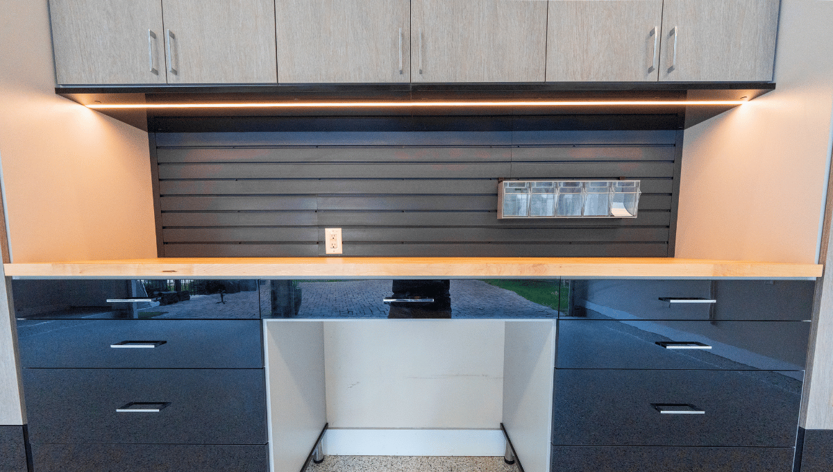 Custom garage workshop with slatwall storage designed by SpaceManager Closets