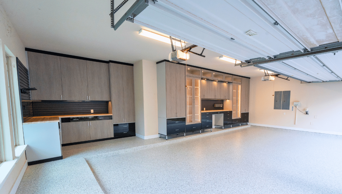 Custom garage storage with built-in workshop designed by SpaceManager Closets