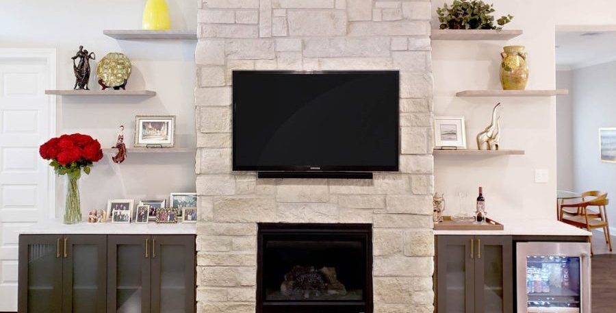 Entertainment Center with floating shelves, cabinets and fridge