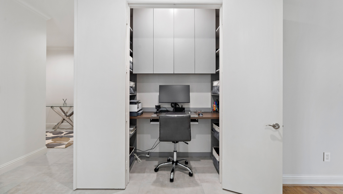 Reach In office closet converted to workspace designed by SpaceManager Closets