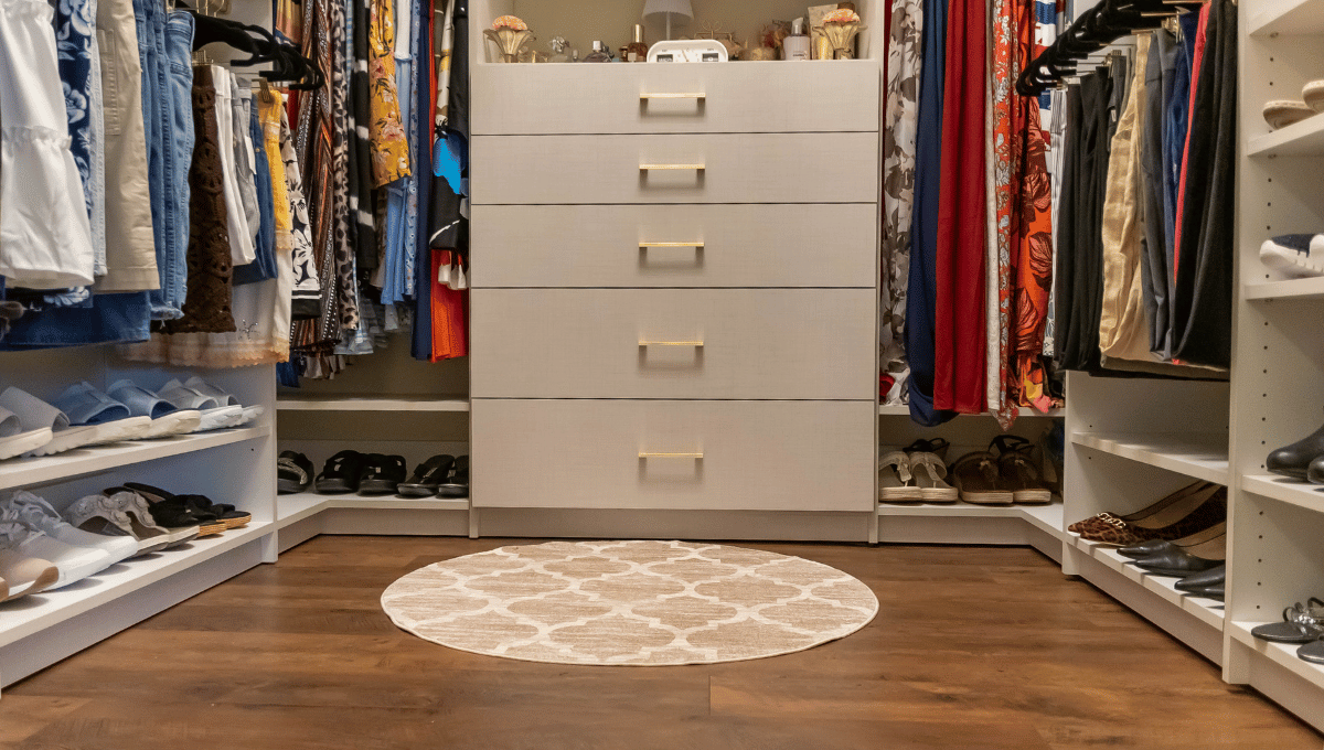 Custom walk-in closet with floor-to-ceiling functional storage.