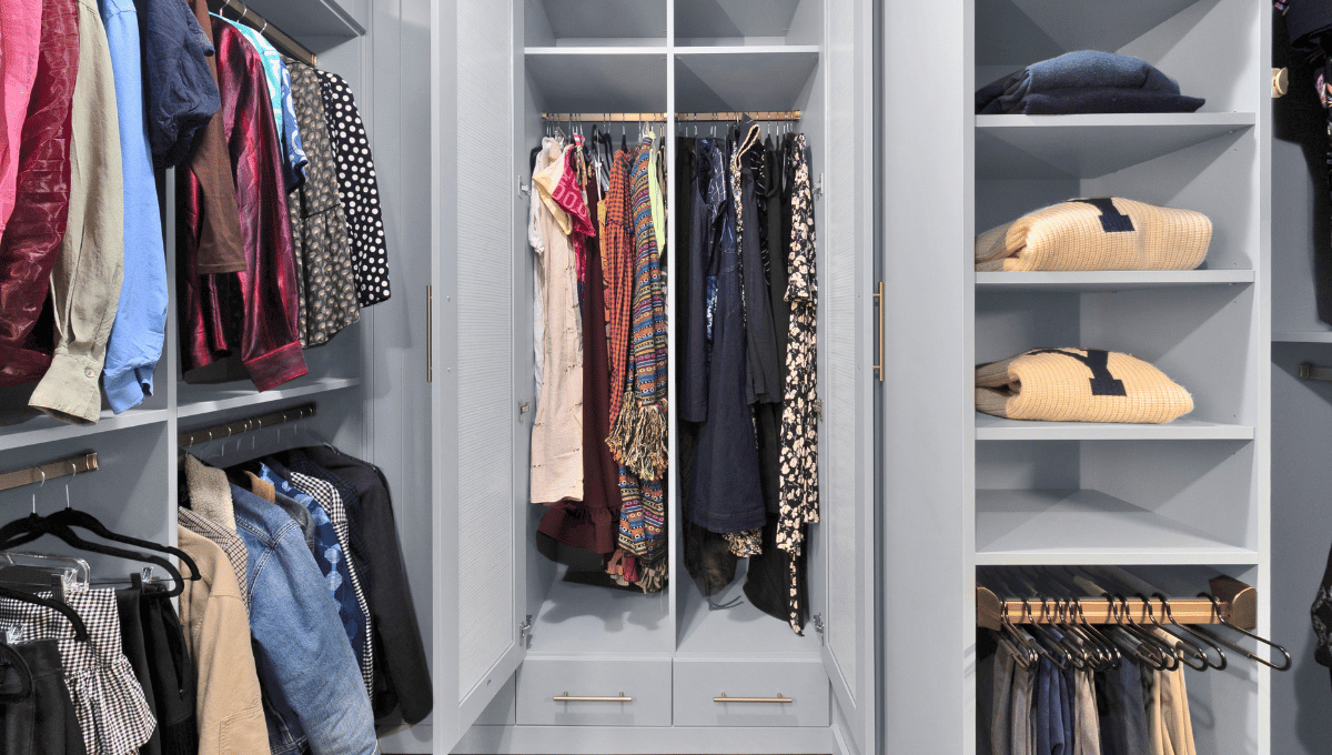 Custom closet in blue tone with brass hardware — Houston closet design