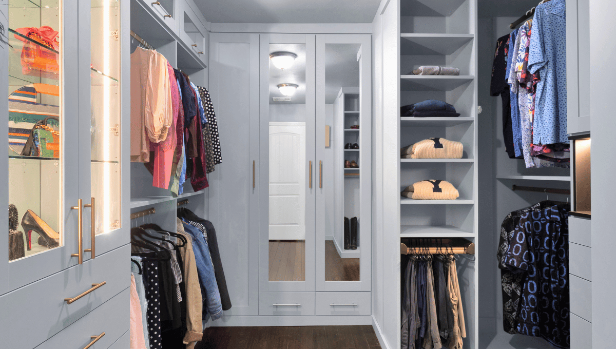 Photo of a custom his and hers closet designed and installed in Houston, Tx. 