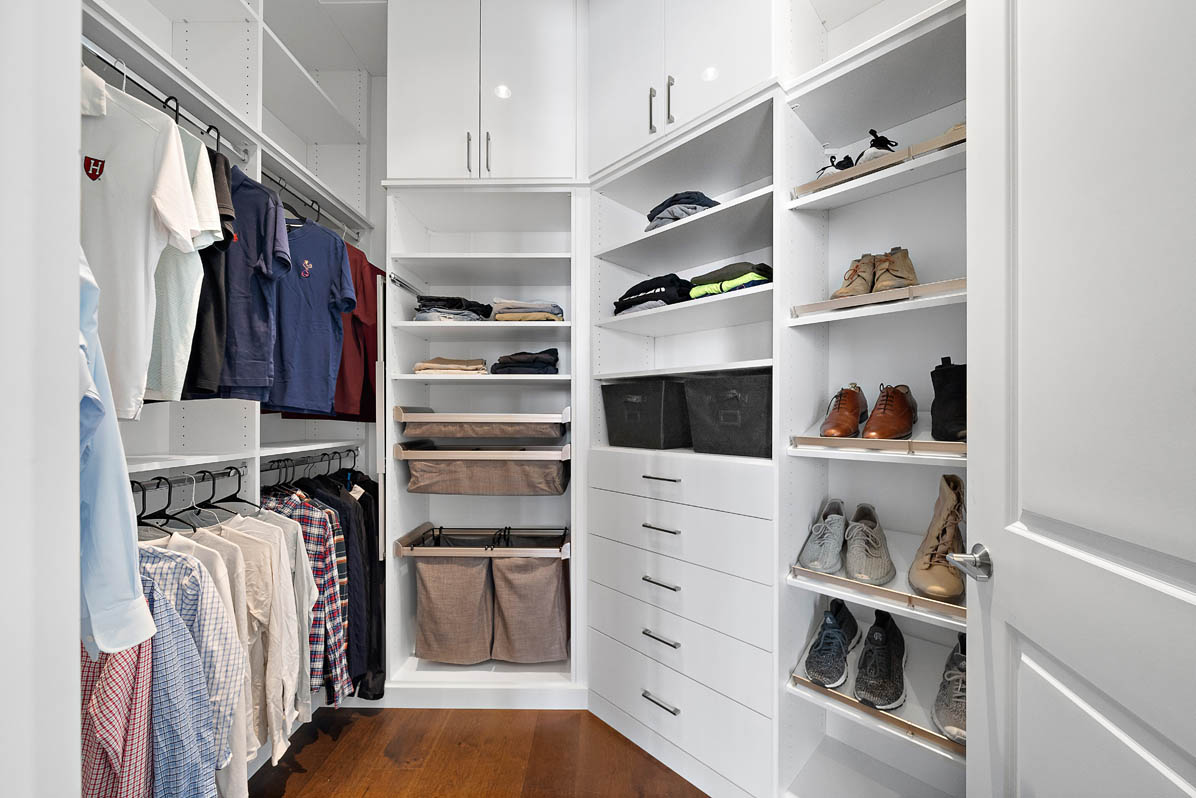 Custom closet with built-in shelving and drawers
