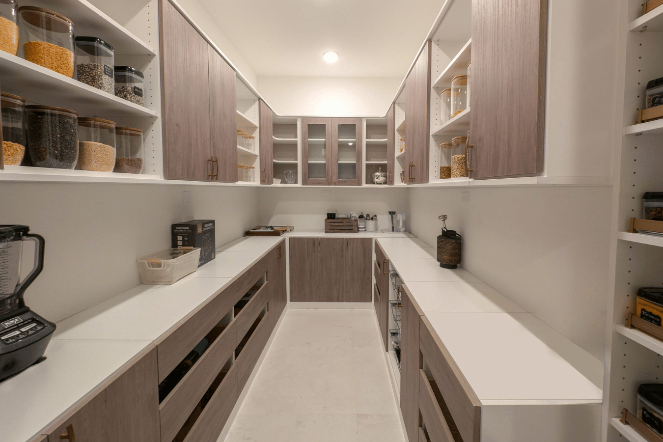 Walk in pantry with custom shelving and organized food storage